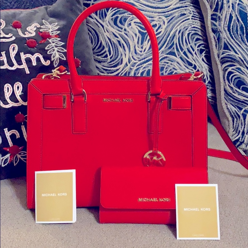 Red Michael Kors satchel matching wallet.